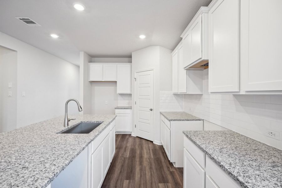 Kitchen in the Allen floorplan at a Meritage Homes community.