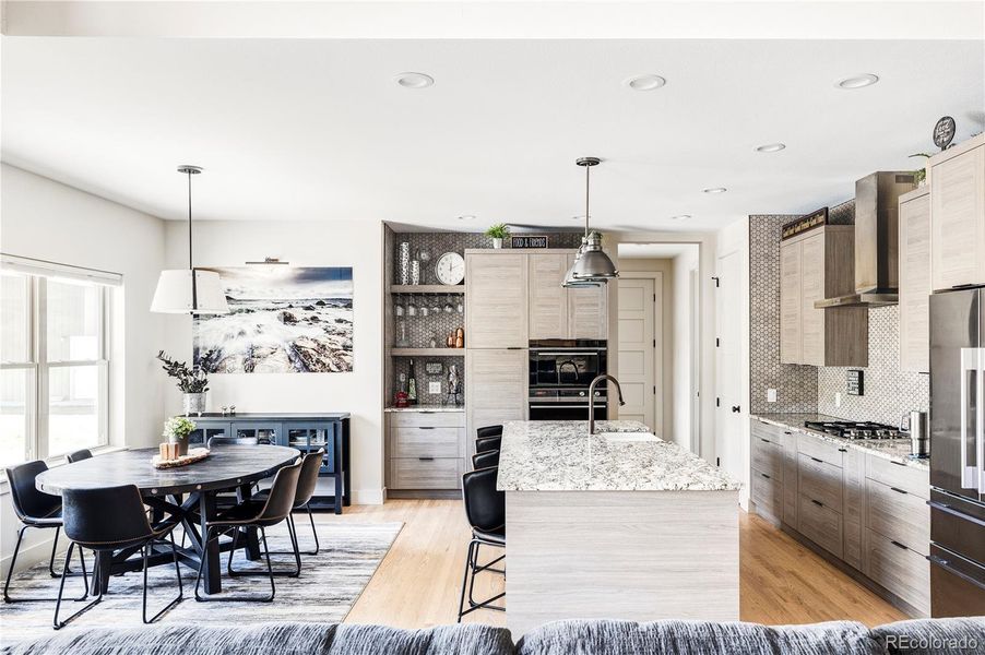 Kitchen w/ views to garage entry & laundry/mudroom.