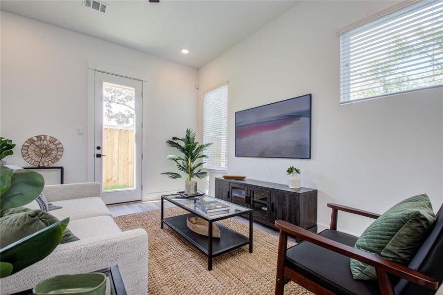 The living area in these beautiful homes is surrounded by windows! Model home photos - FINISHES AND LAYOUT MAY VARY! Ceiling fans are NOT INCLUDED!