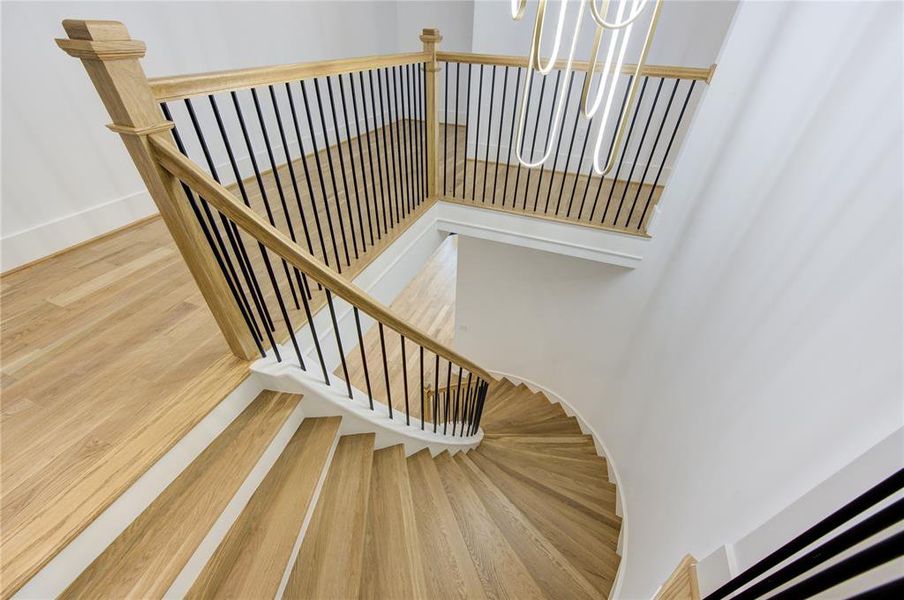 Beautifully crafted circular stair with similar White Oak Solid Hardwood as the rest of the floors. No carpet here pls