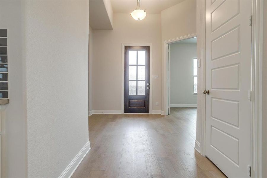 Foyer featuring light wood-type flooring