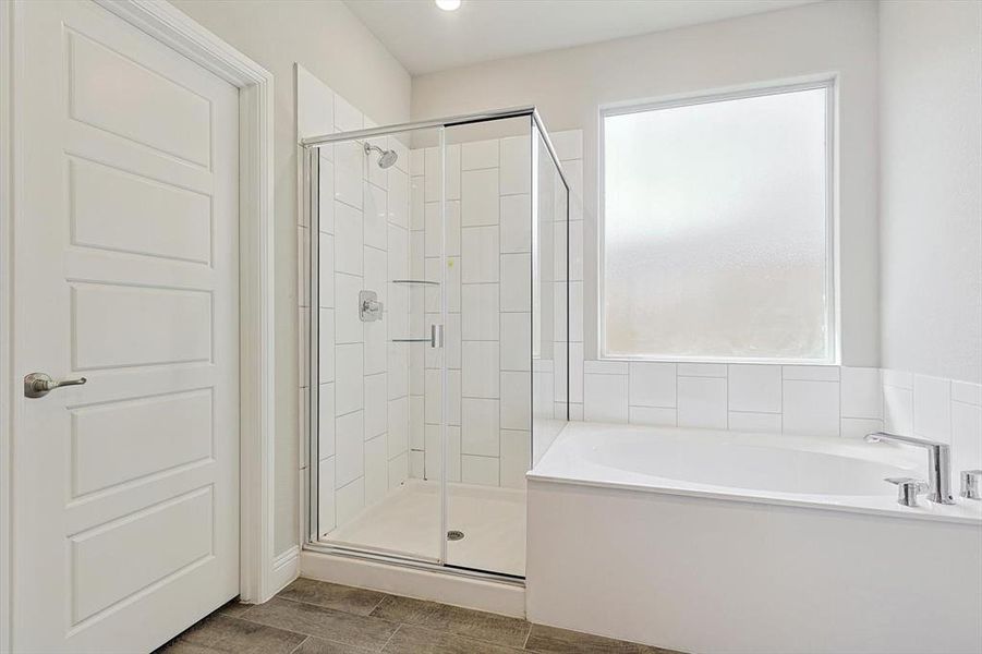 LARGE Ensuite bathroom with dual sinks, quartz countertops, separate shower, large soaking tub and LARGE walk in closet