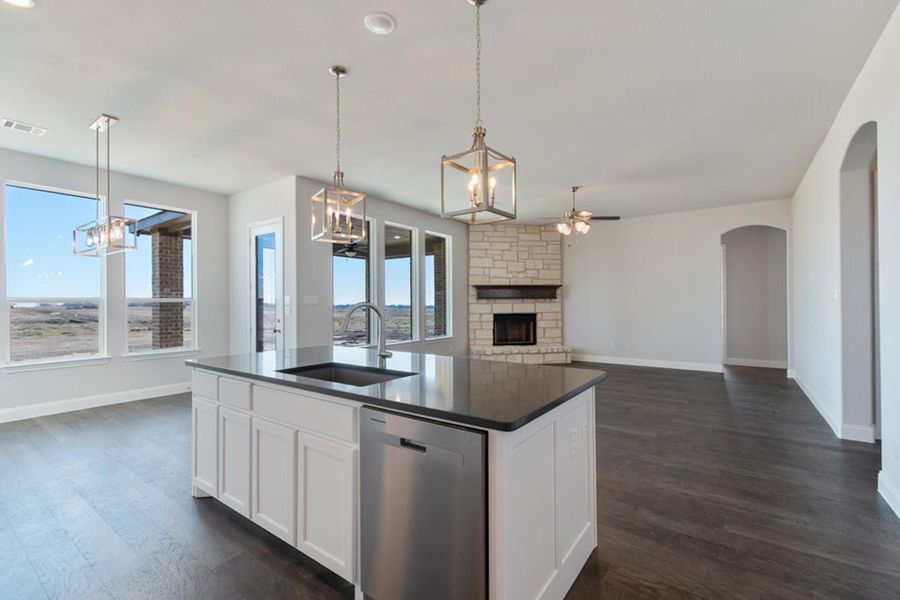 Kitchen & Family Room | Concept 2406 at Hidden Creek Estates in Van Alstyne, TX by Landsea Homes