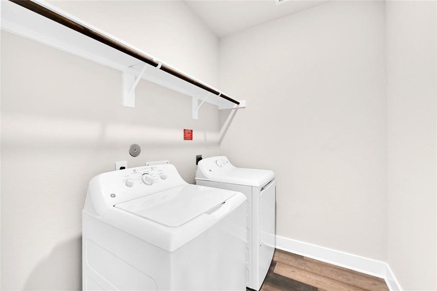 Your in-home utility room also features built-in shelving and hanging rods, gorgeous luxury vinyl plank flooring, and is large enough to fit your favorite full sized washer & dryer set.