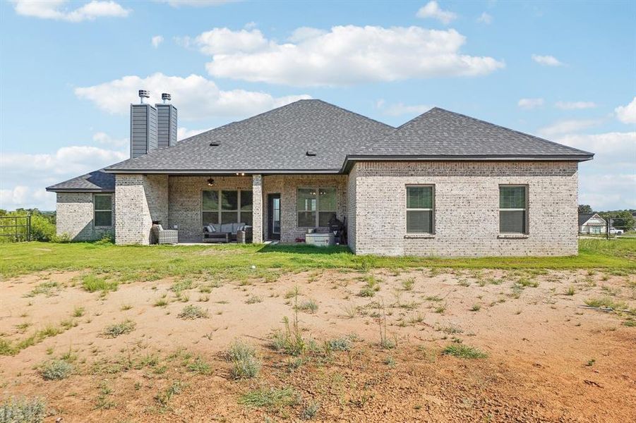 Rear view of property with a patio area