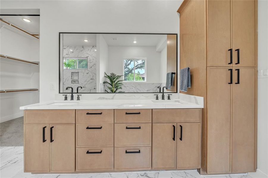 Bathroom with tile patterned floors and dual bowl vanity