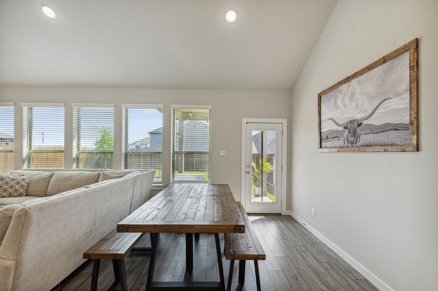 Dine-in kitchen with view of exterior door and backyard