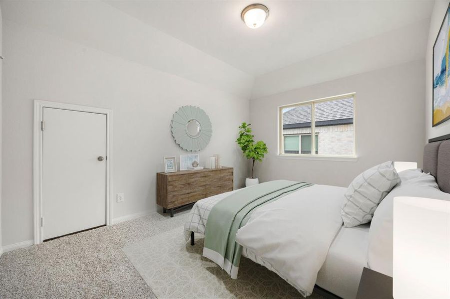 Secondary bedroom features plush carpet, neutral paint, ample closet, lighting and a large window with privacy blinds.