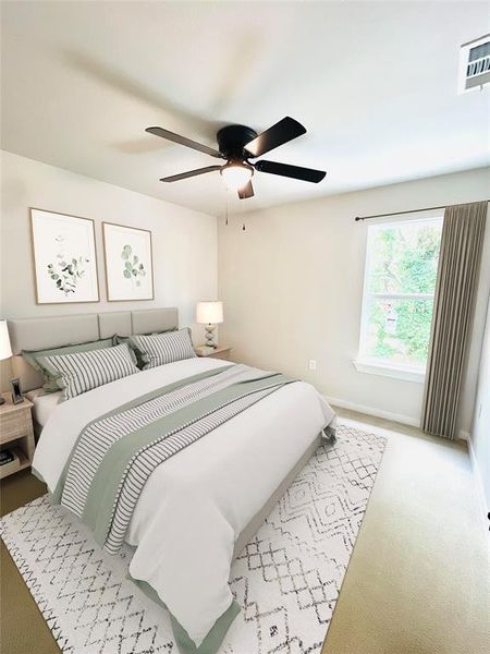 Carpeted bedroom featuring ceiling fan