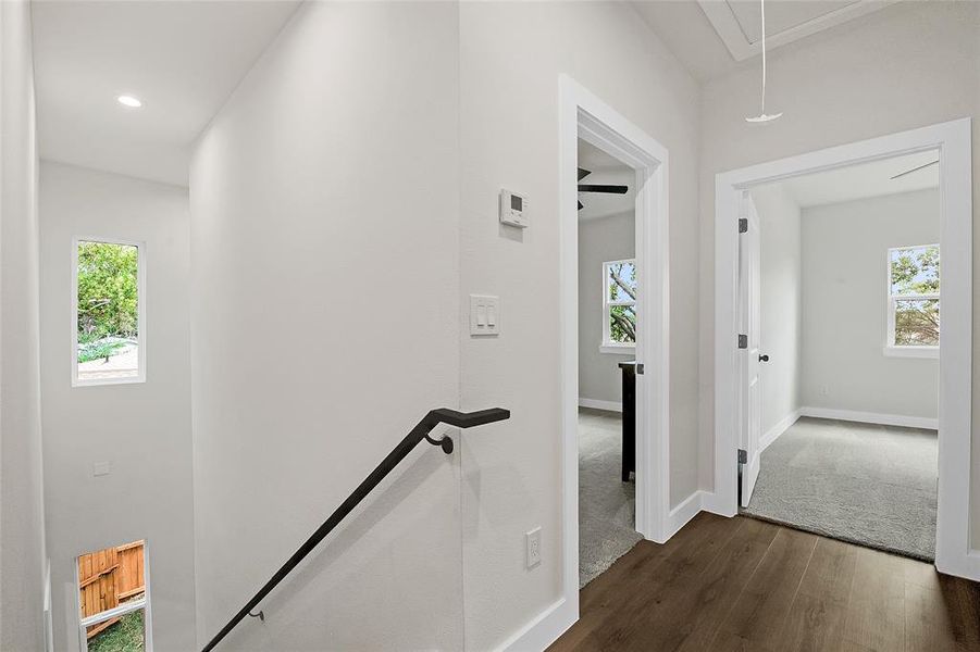 Upstairs Hallway with wood-type flooring