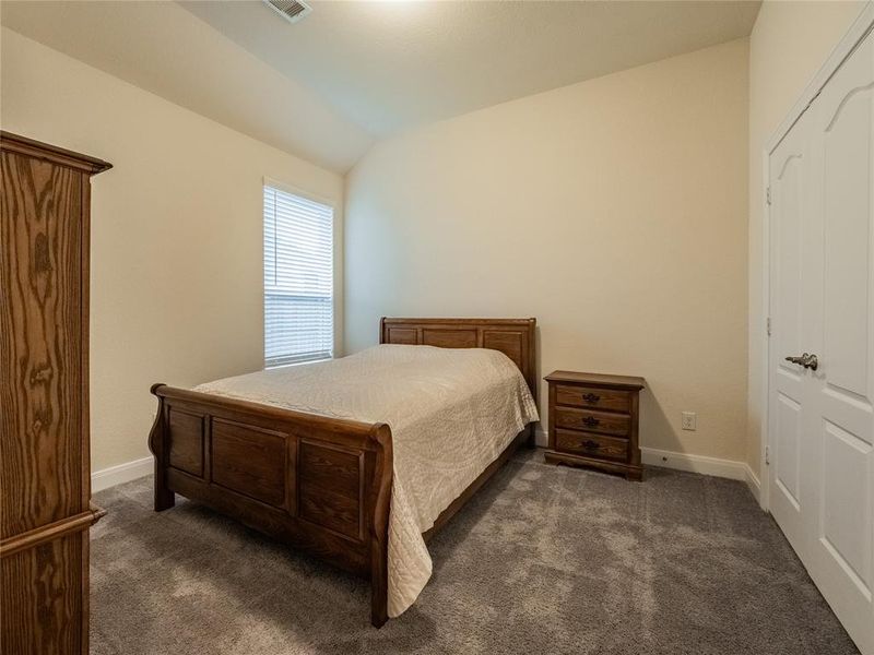 this is your secondary bedroom one with beautiful carpet just like new, roomy and closet with double doors. the bedrooms are split floor plan which gives privacy for the primary