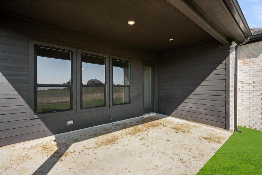 Doorway to property with a patio