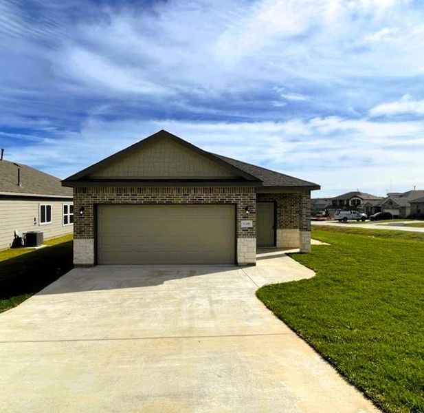 Gorgeous stone & brick front elevation on an oversized corner lot!