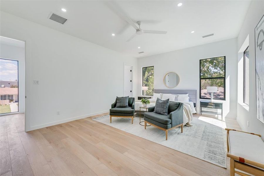 Bedroom with light hardwood / wood-style flooring and ceiling fan