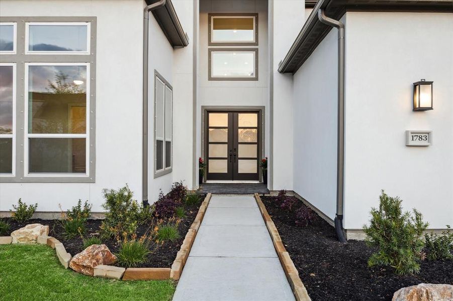 Take a look at the beautiful landscaping and stone borders as you enter this home! There is also an irrigation system in the front and back yard.