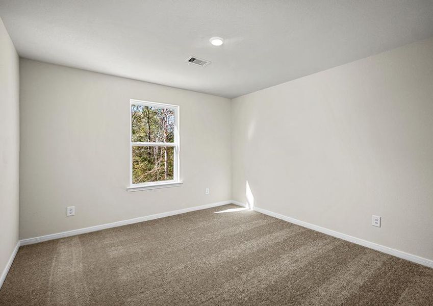 One of three additional bedrooms.