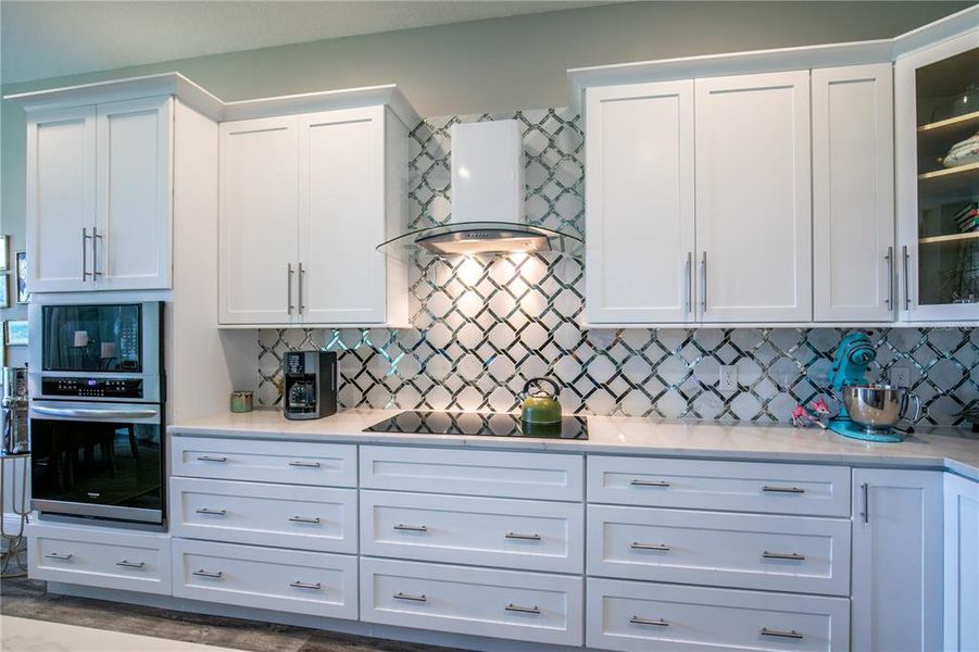 The beautiful backsplash accentuates the soft-close cabinetry.