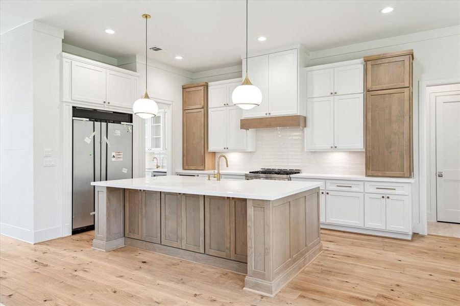 Chef's dream offers ample cabinetry and countertop space providing and ideal setting for entertaining large groups.
