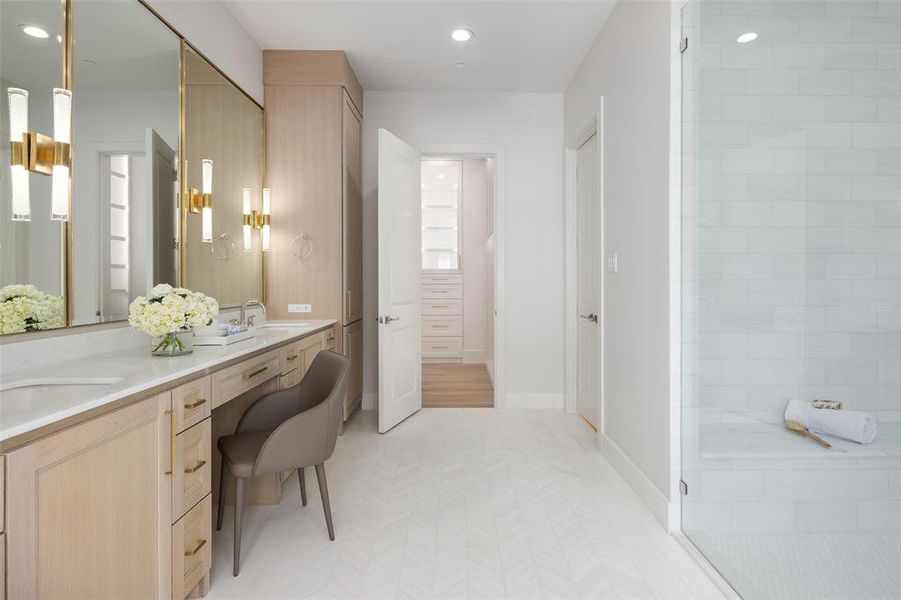 Bathroom featuring walk in shower, tile flooring, and double vanity