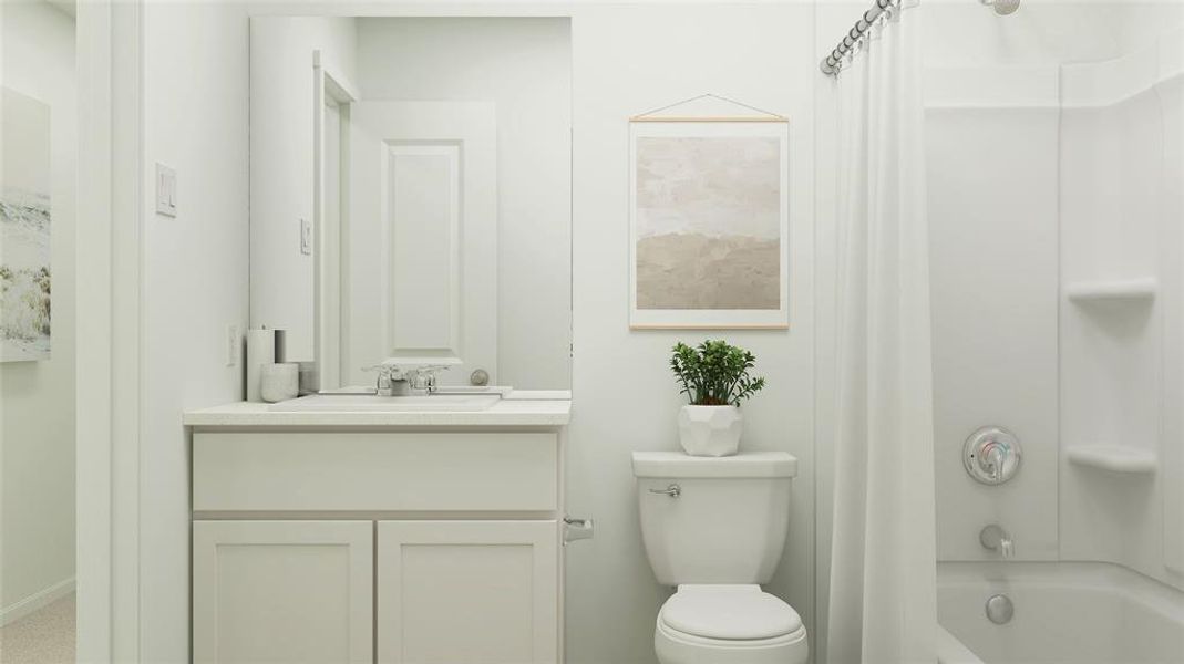 Full bathroom featuring toilet, shower / tub combo with curtain, and vanity