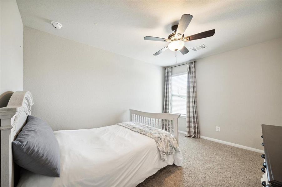 These bedrooms are all nicely sized and have walk-in closets. Ceiling fan and blinds complete the features. Draperies do not convey.