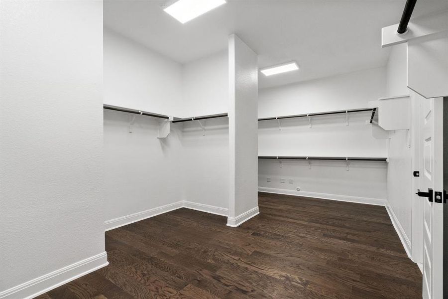 The primary features an expansive walk in closet that also is conveniently connected to the laundry room