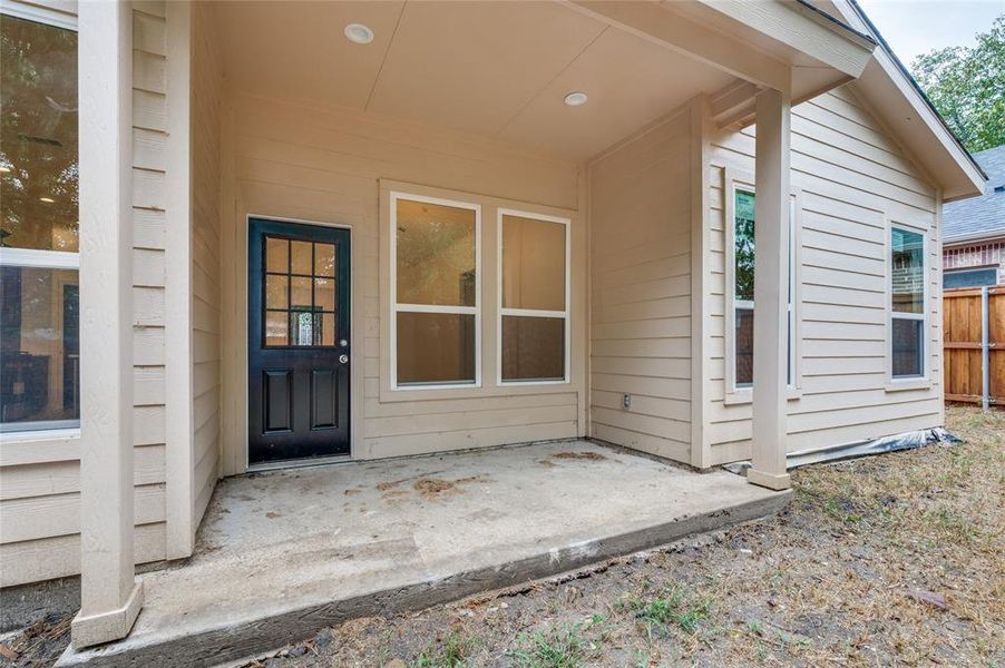 View of exterior entry featuring a patio area