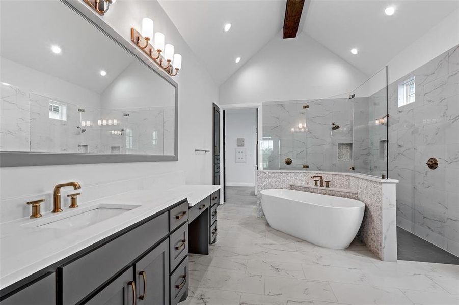 Bathroom featuring tile flooring, plus walk in shower, beam ceiling, high vaulted ceiling, and vanity