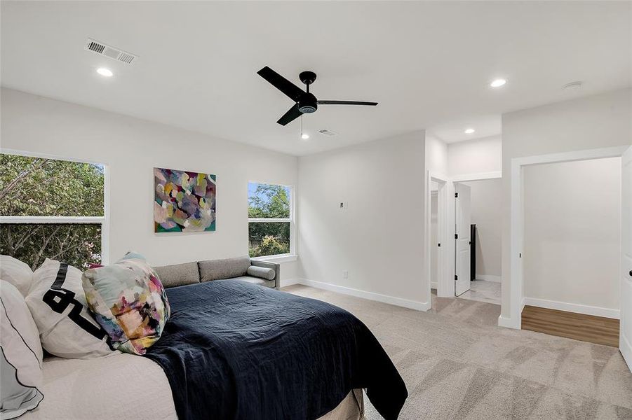 Bedroom featuring ceiling fan and light colored carpet