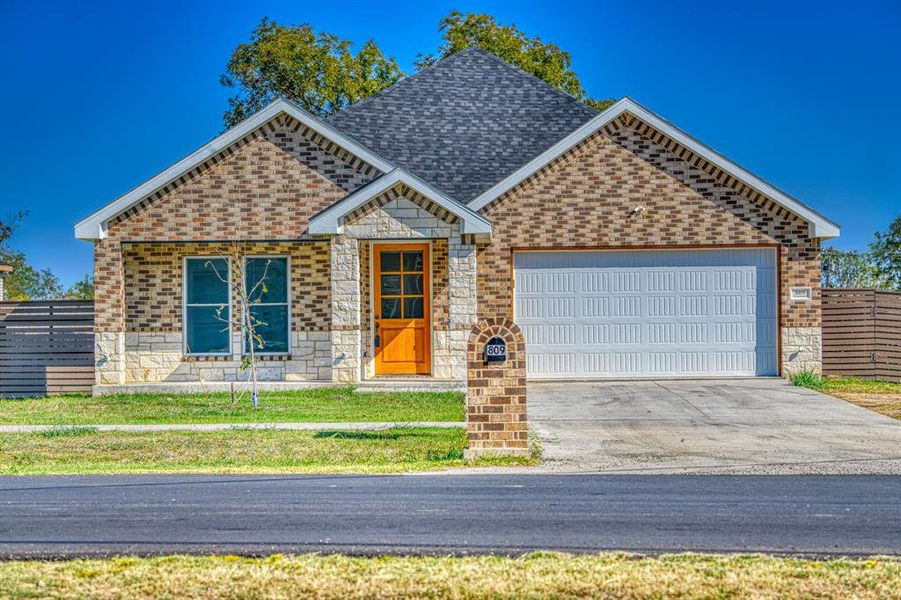 View of front of home featuring a garage