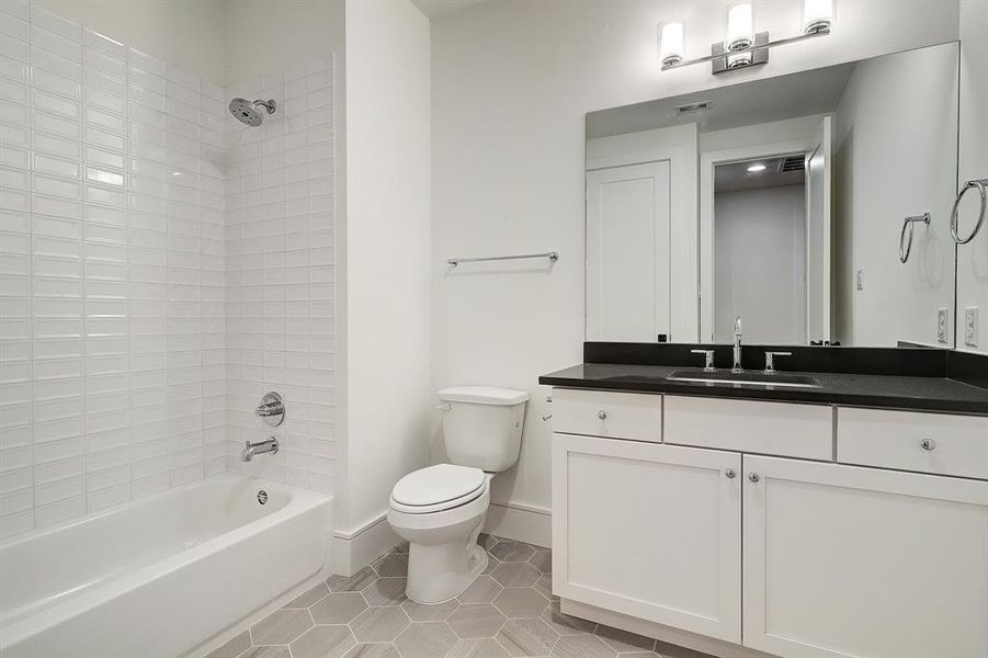 A full bath - The fourth bedroom makes for an ideal guest suite.