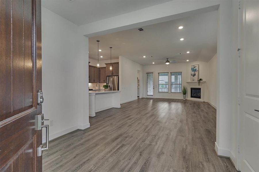 This beautifully appointed, open-concept floor plan will not disappoint with high ceilings, durable yet luxurious vinyl plank flooring, and a floor plan with great flow & function!