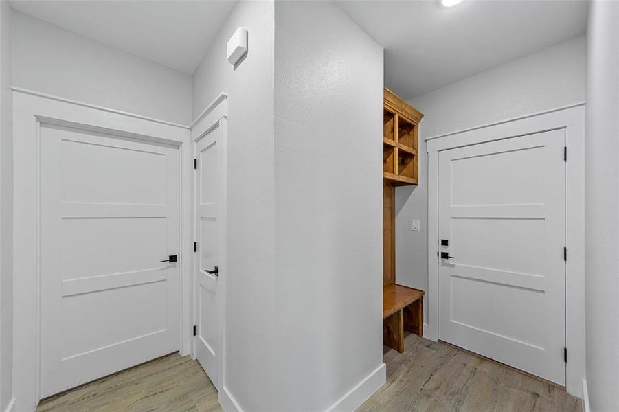 Mudroom featuring light wood-type flooring