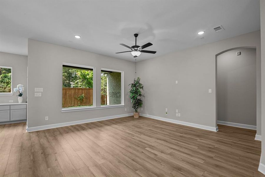 Big windows overlook a fully sodded rear yard!