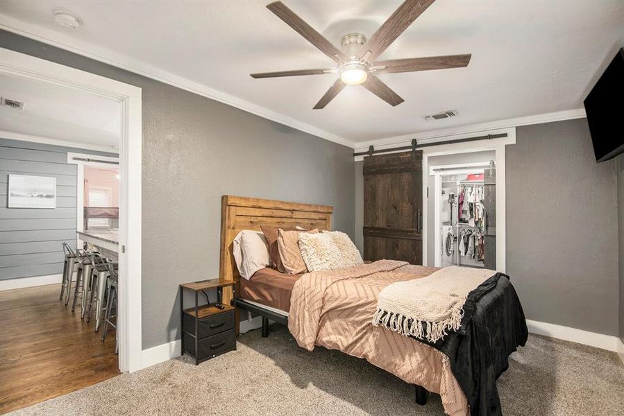 Barndoor can be closed to hide the large walk in closet and laundry room.