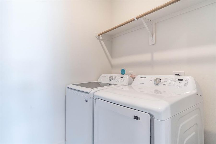 Enjoy the convenience of a spacious laundry room, providing ample space for sorting, folding, and storage, making laundry tasks a breeze.