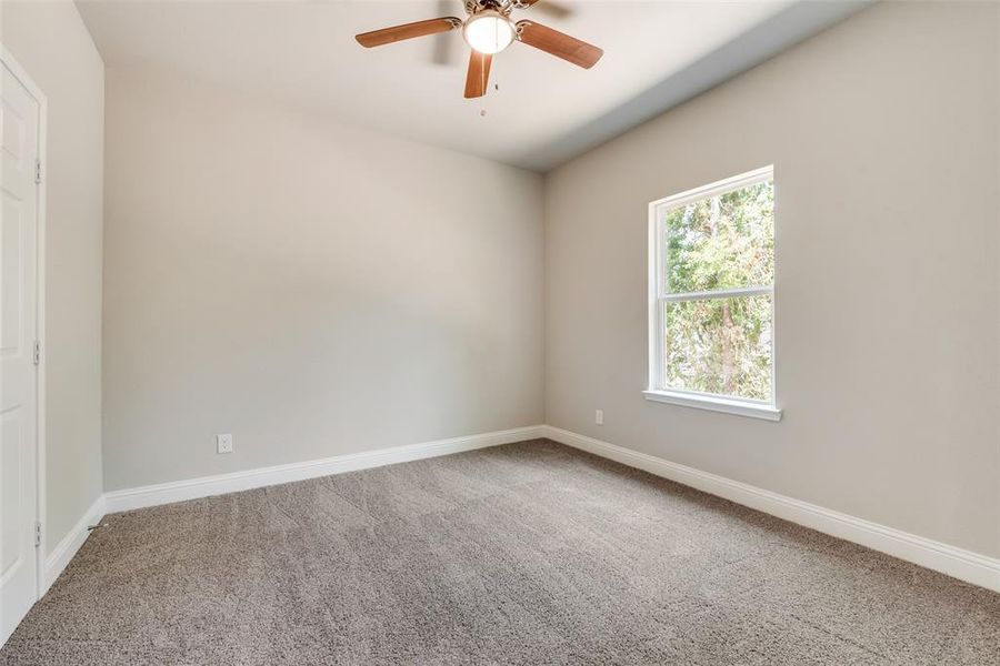 Unfurnished room with carpet flooring and ceiling fan