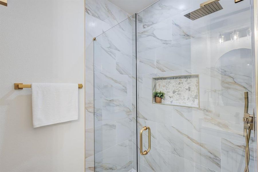 Bathroom featuring walk in shower