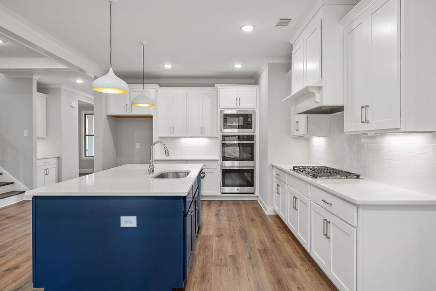 Expansive kitchen with elegant white cabinets