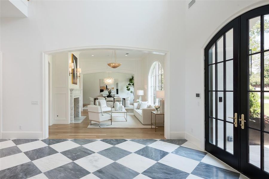 Foyer entrance featuring french doors and hardwood / wood-style floors