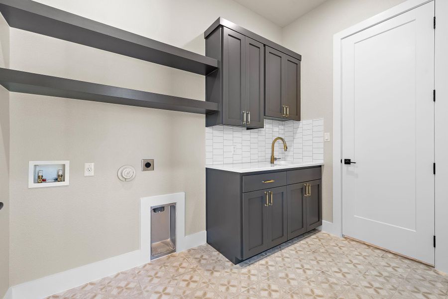 Laundry room with large closet