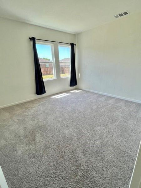 Empty room with carpet floors