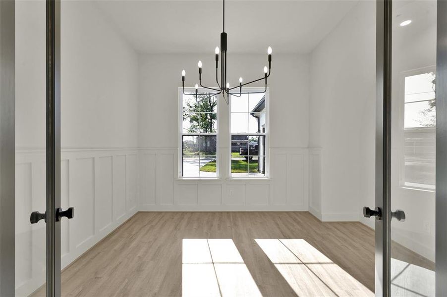 Office/Study with wainscoting paneling.