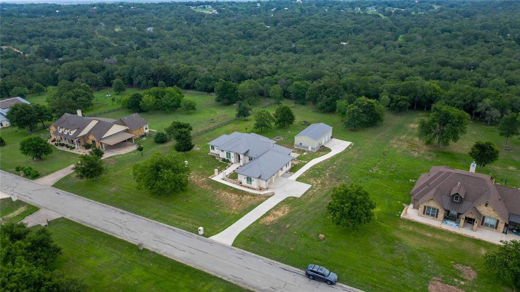 Aerial of property with greenbelt behind