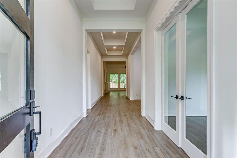 WELCOME HOME! Step inside and you will fall in love! The front foyer features hardwood floors, designer paint, tall ceilings, and an ample amount of natural light.
