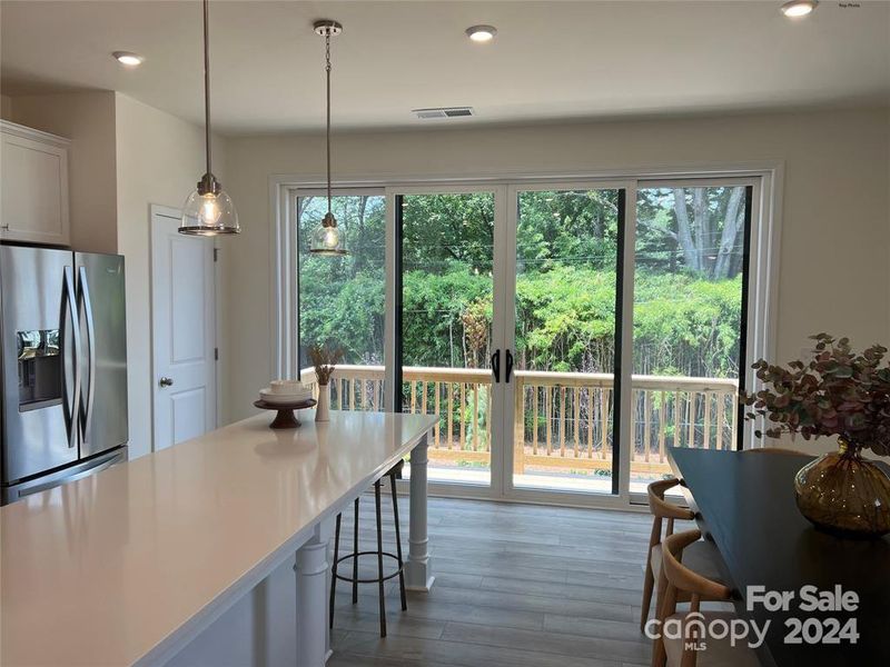 Large Island and Oversized Sliding Windows off Kitchen