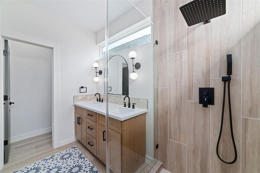 A primary bathroom featuring walk-in shower, offers a spa-like retreat, combining the convenience of a quick shower. The primary bathroom has double sinks!