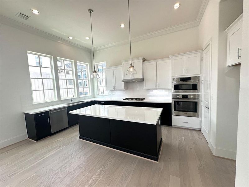 Tuxedo Kitchen w/ Bosch Appliances, European Style Soft Closing Cabinetry, Hardware and Quartz Countertops