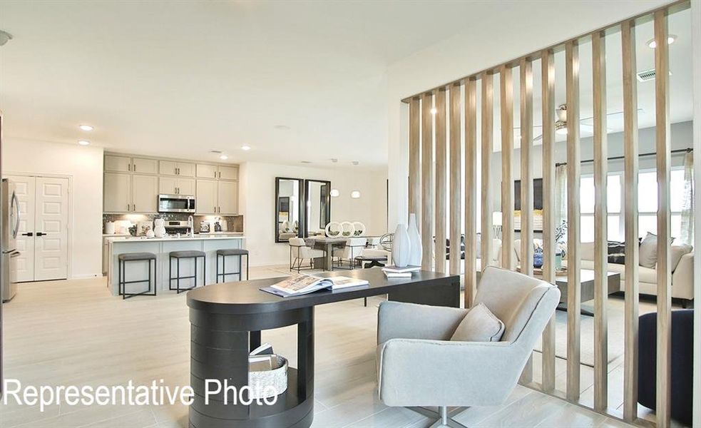 Living room with light hardwood / wood-style flooring