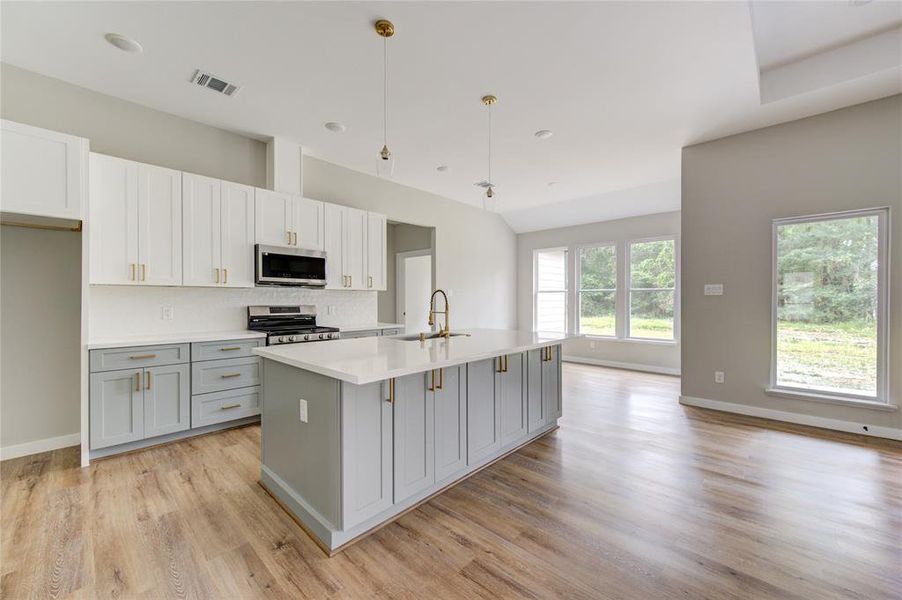 Large kitchen and island w/double deep sink located in the lsland